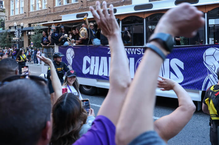 Orlando Pride players celebrate their National Women’s Soccer League championship during a victory parade on Orange Avenue in Downtown Orlando on Monday, Nov. 25, 2024. (Rich Pope, Orlando Sentinel)